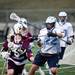 A Skyline lacrosse player defends in the game against Okemos on Tuesday, April 9. AnnArbor.com I Daniel Brenner